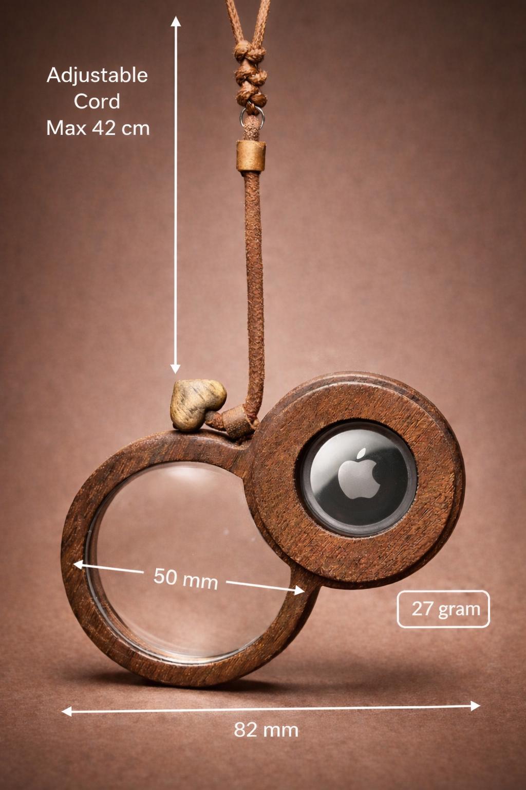 Wooden magnifying glass pendant with hidden AirTag compartment for tracking device.