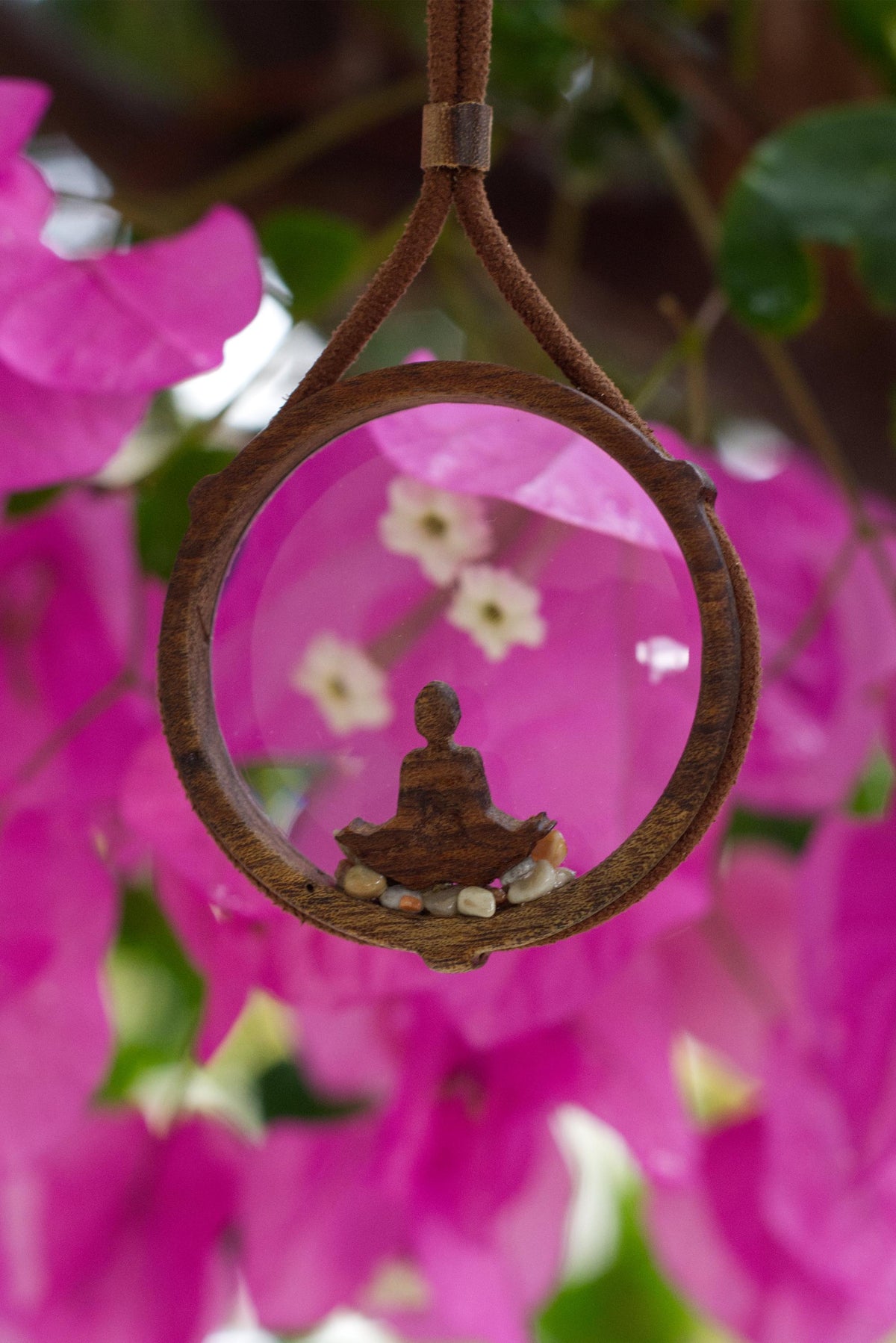 Zen-themed magnifying glass necklace with leather cord