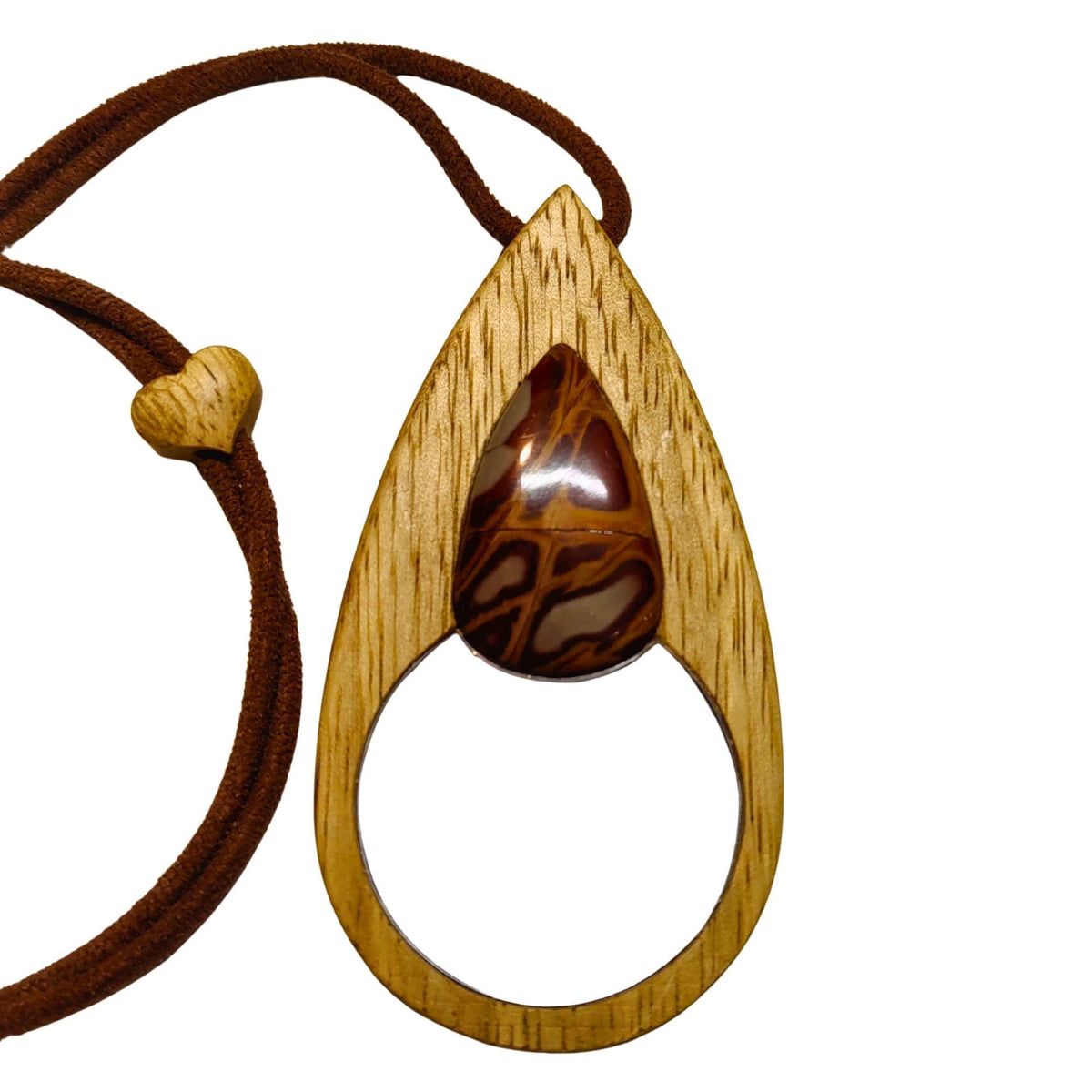 An elegant magnifying glass necklace where beech wood and Noreena Jasper come together.