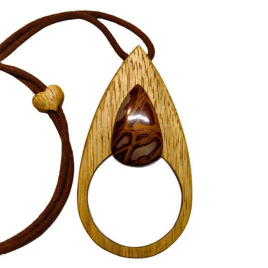 An elegant magnifying glass necklace where beech wood and Noreena Jasper come together.